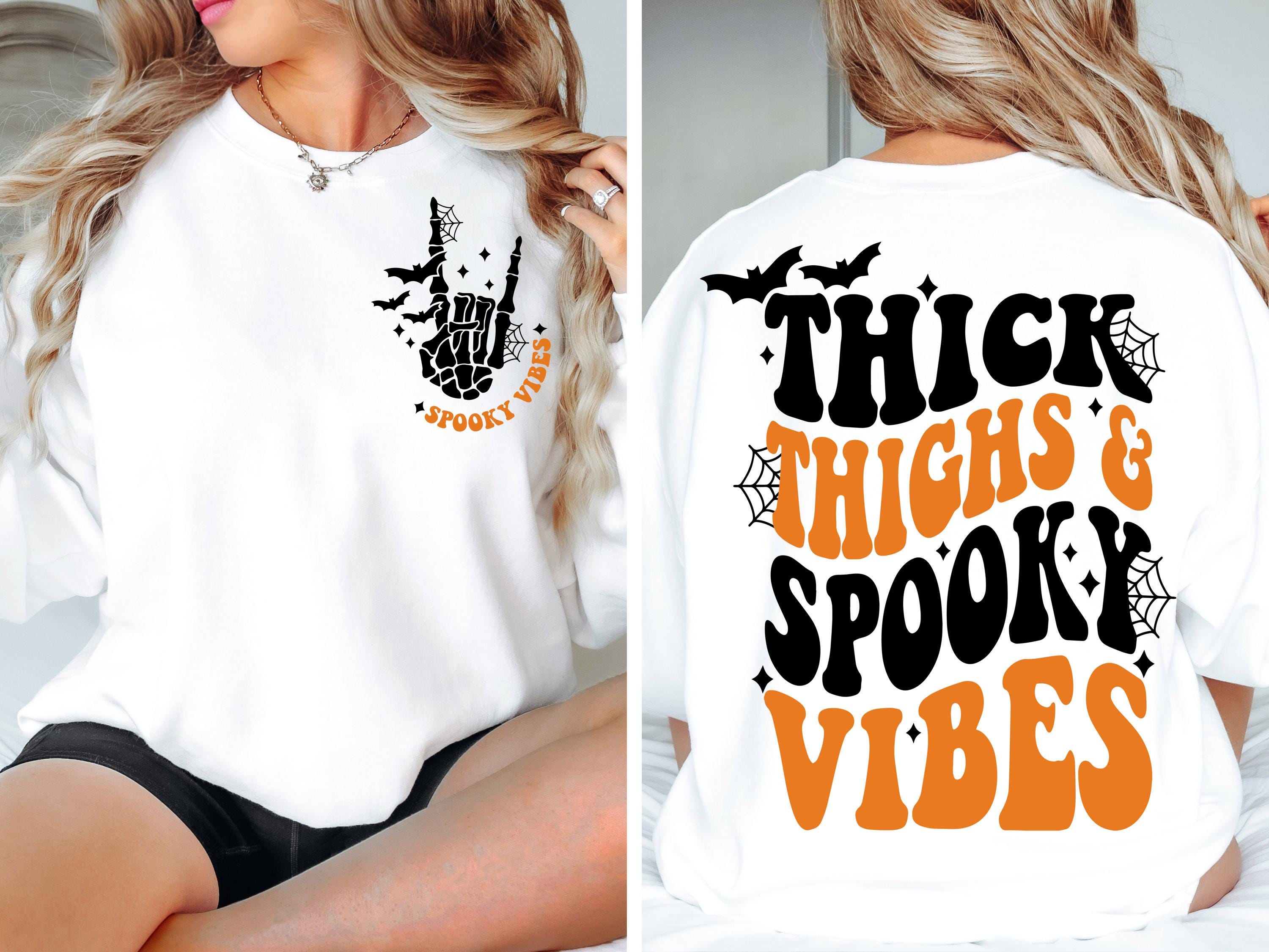 Thick Thighs Spooky Vibes Sweatshirt: Retro Halloween Graphic Tee